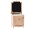 Maileg's Mouse Sink and Mirror in Dark Powder is a charming pink freestanding vanity with a mirror, white countertop, brass faucets, and cabinet door with a knob—ideal for any tiny Maileg mouse manor.