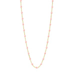 The Classic Gigi Necklace 16.5" by Gigi Clozeau showcases an 18-carat yellow gold chain accented with striking pink beads, evenly spaced along its length.