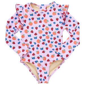 The Pink Chicken Girls' Rachel Suit is a pink one-piece swimsuit for children, featuring long sleeves, a playful strawberry pattern, and ruffled shoulders.