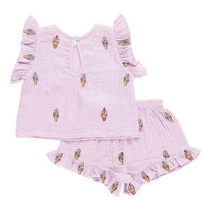 Meet the Girls' Roey 2-Piece Set by Pink Chicken: a charming lavender ensemble in double cloth cotton gauze. The outfit includes a sleeveless top and shorts, adorned with ice cream cone patterns and ruffled details—ideal for sweet summer days.