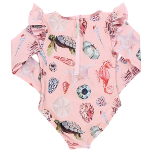 The Pink Chicken Girls' Rachel Suit is a delightful pink swimsuit with long sleeves for sun protection, featuring watercolor shell, turtle, and marine life patterns. It includes a front zipper and ruffled shoulders for extra style.