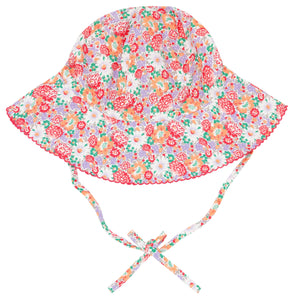 The Baby Girls' Island Blossom Sun Hat by Minnow is a colorful cotton sun hat featuring a floral pattern, wide brim, and adjustable chin straps.
