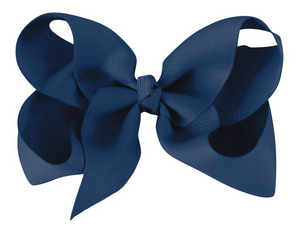 The Milledeux Girls' Large Boutique Bow features wide loops and textured, glossy navy fabric—handmade for an elegant hair accessory.