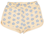 The Girls' Georgia Short by Louis Louise features sponge cotton in a vibrant yellow with an elasticated waist, a blue floral pattern, and handy side pockets.