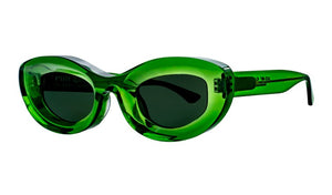 Thierry Lasry's Jazz Sunglasses feature a green, oval-shaped design with dark tinted lenses and a thick frame, shown against a white background.