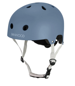 The Banwood Eco Helmet in blue, made from recycled materials, features ventilation holes and adjustable white straps, and is shown against a white background.
