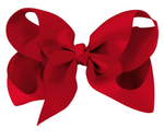 The Milledeux Girls' Large Boutique Bow features a handmade design with wide loops and tails in a bold red, perfect for hair and displayed against a plain white background.