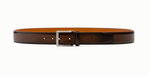 The Viento Belt by Magnanni is a brown calfskin leather belt featuring a brushed nickel buckle, laid out flat.