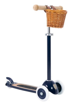 Banwood's Scooter enhances balance and motor skills, featuring a charming design with three white wheels, a wooden deck, and handlebar. It includes a small wicker basket, perfect for little adventurers.