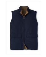 The Peter Millar Brentwood Reversible Fleece Vest, in navy blue, includes a front zipper, high collar, and two pockets. It's made from water-resistant fabric for windproof protection.
