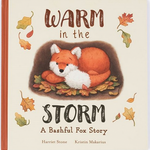 The Jellycat Warm in the Storm Book, titled "A Bashful Fox Story" by Harriet Stone and Kristin Makarius, features a fox among autumn leaves with enchanting rhymes, ideal for a bedtime favorite.