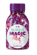 A purple Crocodile Creek Bubble Magic bottle (8.45 fl oz/250 ml) with unicorn and rainbow designs, ideal for bubbles and outdoor play, suitable for ages 3+.