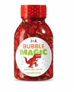 Crocodile Creek Bubble Magic—8.45 fl oz (250 mL) red bottle with dinosaur illustrations. Includes bubble wands for ages 3+; perfect for outdoor play.