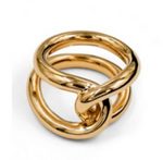 Introducing the Agnes Ring by Lie Studio: a gold masterpiece with intricate circular loops in a complex geometric design, complete with an elegant knot-tie detail.