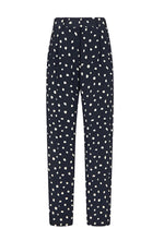 The Mariquita Nana Pants by Blaze Milano are navy blue silk, high-waisted trousers with white polka dots, a straight-leg cut, and elegant pleats at the waistband.