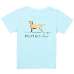 Light blue Boys' Short-Sleeve Tee by Properly Tied, made with soft Pima cotton and showcasing hand-drawn graphics of a dog on a surfboard above "Properly Tied.