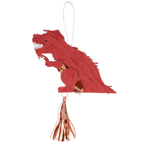 The Meri Meri Piñata Favor is a red, dinosaur-shaped ornament with a hanging loop and metallic tassel—ideal for party favors or themed decor. Displayed on a white background.