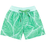 The Boys' Riviera Swim Trunk by Properly Tied features green shorts with a white palm leaf pattern, a light green elastic waistband and tie, and is crafted from quick-dry material with a FlexFlight Compression liner for comfort in and out of the water.