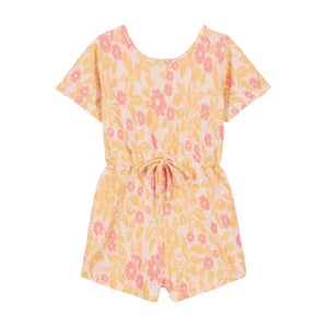 The Louise Misha Chiara Playsuit for baby girls and girls features a pink and yellow floral pattern, short sleeves, and a cinched waist tie, all crafted from luxurious jacquard.