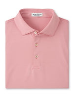The Peter Millar Jubilee Performance Jersey Polo is a folded red and white striped shirt with a collar, three buttons, UPF 50+ sun protection, and the "Peter Millar" label inside the neckline.