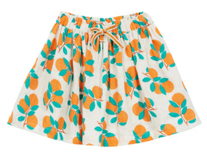 The Girls' Fiza Skirt by Arsene & Les Pipelettes features a white design with a clementine print, green leaves, an elasticated waist, and a drawstring—perfect for adding a pop of color to any wardrobe.