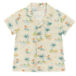 The Kids' Federico Shirt by Arsene & Les Pipelettes is a short-sleeved cream shirt featuring a vibrant mermaid print with palm trees and beach scenes, plus a collar, front buttons, and chest pocket.