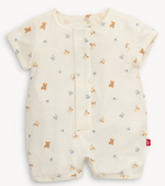 The Magnetic Me Baby Romper is made from soft TENCEL™ modal in light cream, with cute teddy bear, block, and duck prints plus a red tag on the left side seam near the bottom.