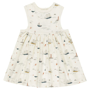 The Rylee & Cru Baby Girls' & Girls' Layla Dress is a sleeveless white cotton jersey babydoll, featuring a nautical sailboats, lighthouses, waves, and seagulls print in soft blue, red, and beige tones.