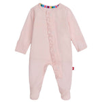 The Baby Girls' Pin Dot Pink Modal Footie with Ruffles by Magnetic Me features long sleeves, a footed design, and charming ruffles along the front. Its multicolored inner neckline adds charm, while TENCEL™ modal fabric ensures ultra-soft comfort.