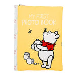The Kids Preferred Winnie the Pooh My First Photo Book has a yellow cover with Pooh holding a honey pot, bees flying around, and honey jars—perfect for saving your baby’s special memories.