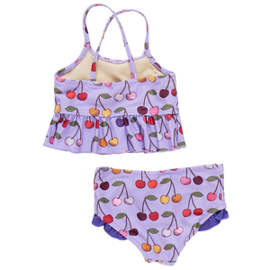 Introducing the Pink Chicken Girls' Joy Tankini, a stylish purple two-piece swimsuit with a playful cherry pattern. The tankini top features a ruffle hem, and the matching bottoms are accented with charming purple frills. Ideal for those seeking joy and style by the water!.