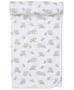 The Kissy Kissy Elephant Esprit Printed Blanket is made from soft Pima cotton, featuring gray cartoon elephants and green grass, with a neatly rolled top edge.