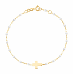 The Little Gigi Classic Cross Charm Bracelet 5.9" by Gigi Clozeau, with gold chain and resin pearls, exudes sophistication and grace.