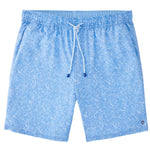 The Ripple Effect Swim Trunk by Peter Millar features a white circular pattern on light blue fabric with an elastic waistband, white drawstring, and four-way stretch—ideal for stylish seaside cocktails.
