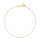 The Gigi Clozeau Little Gigi Classic Bracelet 5.1" is a delicate piece with an 18-carat gold chain accented by evenly spaced white beads, featuring a lobster clasp. It exudes refined elegance, ideal for fans of timeless style.