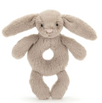 The Jellycat Bashful Beige Bunny Ring Rattle, with long ears and a rounded body, is sure to delight any baby.