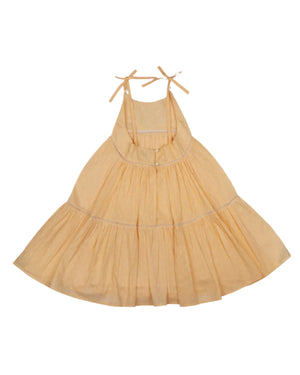 The Early Sunday Girls' Alice Dress is a sleeveless design with shoulder ties and a flared skirt, crafted from cotton dobby fabric, displayed on a white background.