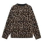 The Anine Bing Sydney Crew Sweater is a long-sleeved, heavyweight cotton blend with a brown and black leopard print in moss stitch, shown against a plain white background.