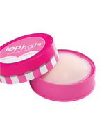 A round pink container labeled "Top Hats" by Commando, with a partially open lid, reveals translucent medical-grade silicone nipple concealers inside.