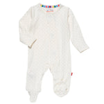 The Magnetic Me Pin Dot Modal Magnetic Parent Favorite Footie is a white baby onesie with small polka dots, long sleeves, foot covers, and a multicolored striped neckline. Made from eco-friendly TENCEL™ modal, it offers temperature-regulating comfort for your little one all day.