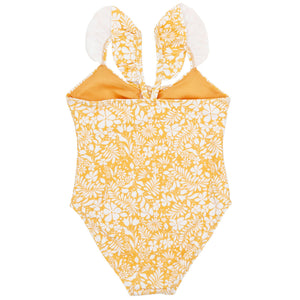The Feather 4 Arrow Baby In a Cinch One-Piece Swimsuit boasts yellow and white floral patterns and ruffled shoulder straps, ideal for beach and pool fun.