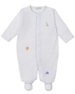 The Kissy Kissy Baby's Safari Wild Footie with Hand Emb. is made from white Peruvian cotton, features blue trim and adorable hand-embroidered giraffe, lion, and elephant designs for a soft, cozy feel.