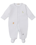 The Kissy Kissy Baby' Safari Wild Footie with Hand Emb. is a white, long-sleeve onesie made of soft Peruvian cotton, featuring small embroidered safari animals like a giraffe, lion, and elephant.