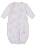 The Kissy Kissy Baby' Giraffe Grace Dotted Convertible Gown features soft white Pima cotton, pink polka dots, long sleeves, front snaps, and sweet pink giraffe accents for cozy comfort and adorable style.