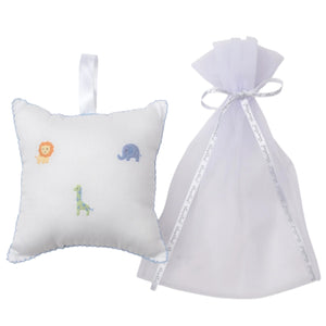 The Kissy Kissy Safari Wild Musical Pillow, featuring embroidered safari animals, sits next to a sheer tulle bag—an adorable baby gift.