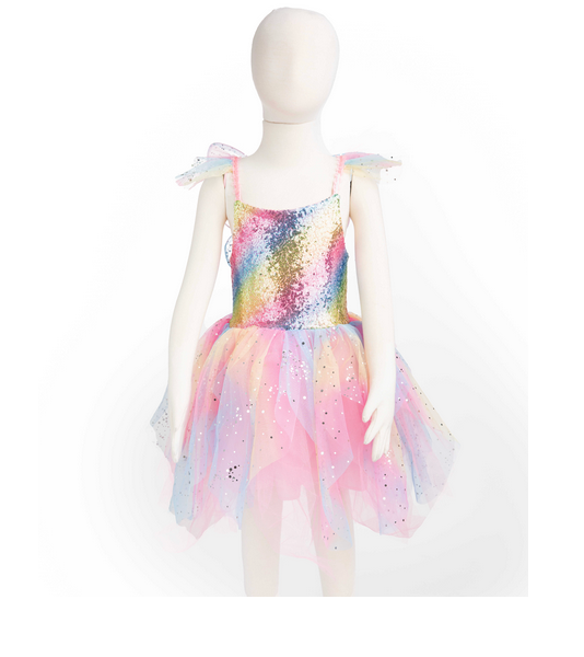 A mannequin displays Great Pretenders' Rainbow Fairy Dress & Wings, featuring colorful sequin detailing and elegant tulle shoulder ruffles, ideal for enchanting occasions.