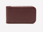 The Ettinger Capra Magnetic Cash Clip, crafted from rectangular brown goat leather with visible edge stitching, is displayed against a plain white background.