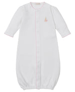 The Kissy Kissy Baby Premier Noah's Ark Convertible Gown with Hand Emb. is a white, long-sleeved Peruvian cotton gown with pink trim, elastic hem, and a small Noah's Ark embroidery on the left chest.