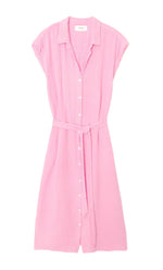 The Aliza Dress by Xirena is a light pink, short-sleeve button-front midi dress made from washed double faced cotton gauze, featuring a collar and adjustable tie-belt, shown on a white background.