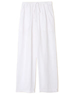 The Xirena Dylan Pant by Xirena features white wide-leg cotton gauze construction, an elastic drawstring waist, and side seam pockets.